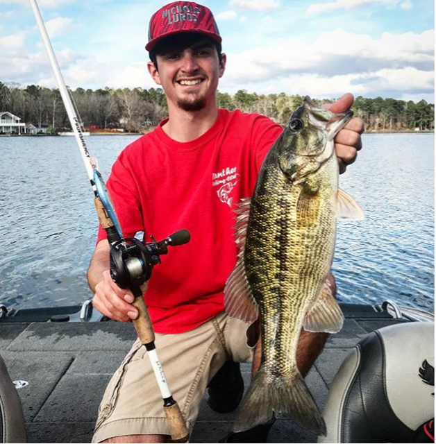 fisherman holding up his catch